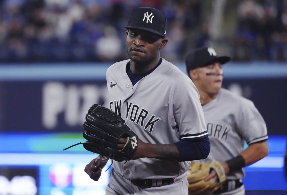 New York Yankees starting pitcher Domingo German walks back to the dugout following the third inning of the team's baseball game against the Toronto Blue Jays on Tuesday, May 16, 2023, in Toronto. (Chris Young/The Canadian Press via AP)