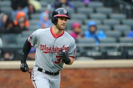 Oct 3, 2015; New York City, NY, USA; Washington Nationals right fielder Bryce Harper (34) heads out on his two run home run during the eighth inning against the New York Mets at Citi Field. Washington Nationals won 3-1. Mandatory Credit: Anthony Gruppuso-USA TODAY Sports