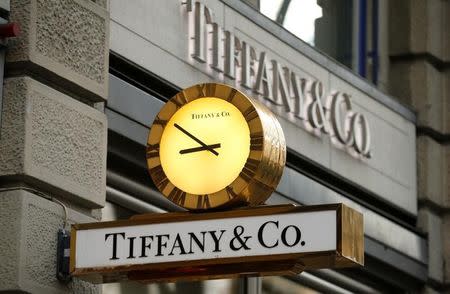 A clock is placed in front of a store of U.S. jeweller Tiffany at the Bahnhofstrasse shopping street in Zurich December 23, 2013. REUTERS/Arnd Wiegmann