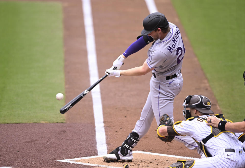 Colorado Rockies' Ryan McMahon (24) hits a single during the first inning of a baseball game against the San Diego Padres, Wednesday, Sept. 20, 2023, in San Diego. (AP Photo/Denis Poroy)