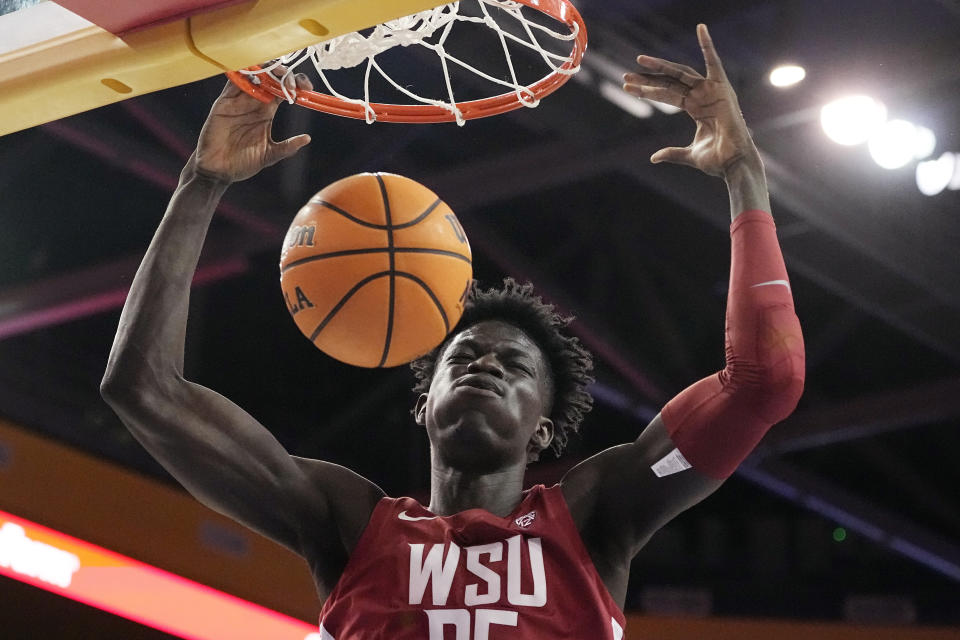Washington State forward Mouhamed Gueye dunks during the first half of an NCAA college basketball game against the UCLA Saturday, Feb. 4, 2023, in Los Angeles. (AP Photo/Mark J. Terrill)