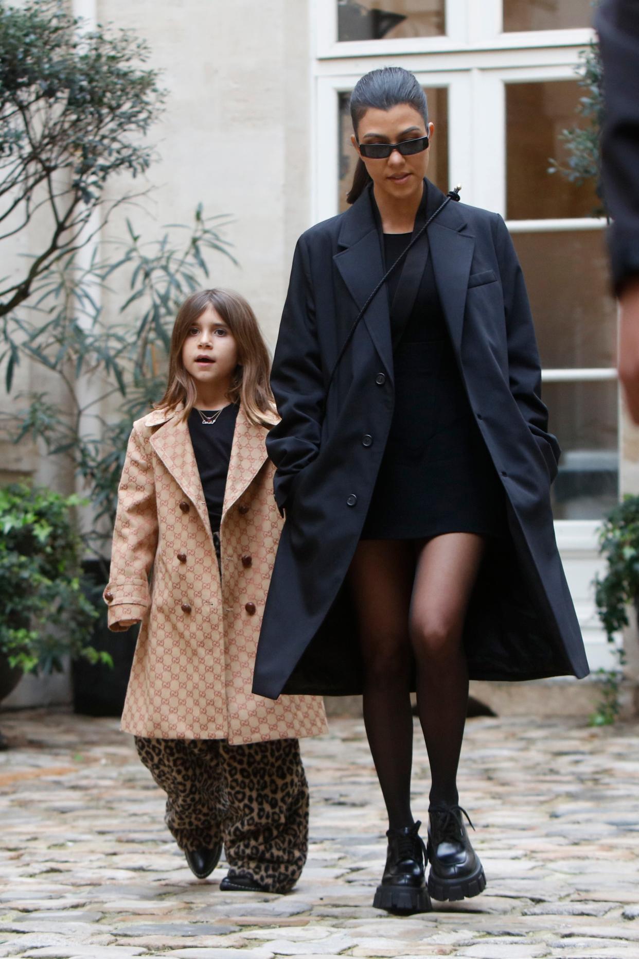 Kourtney Kardashian and Penelope Disick walk hand-in-hand in 2020.