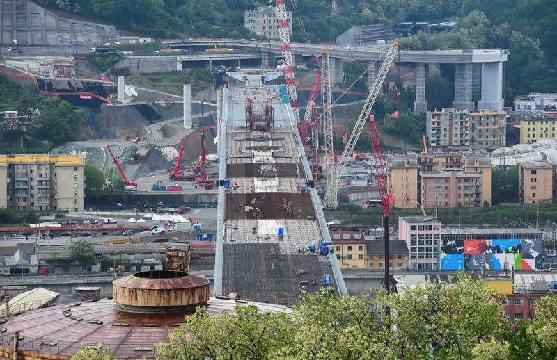 FILE PHOTO: The final section of Genoa's new bridge is installed into place in Genoa