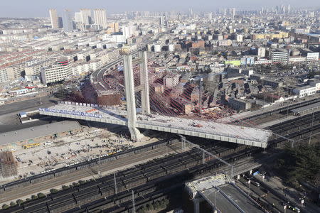 A part of an overpass under construction is turned around in Zoucheng, Shandong province, in this January 19, 2015 file photo. REUTERS/China Daily/Files