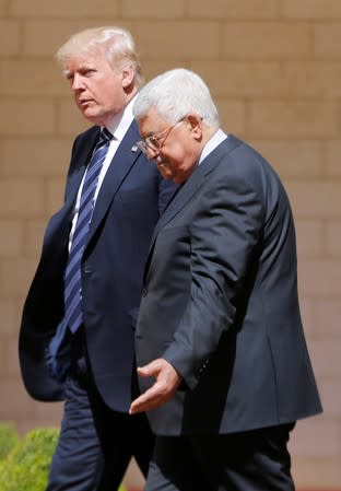 FILE PHOTO: Palestinian President Mahmoud Abbas welcomes U.S. President Donald Trump during a reception ceremony at the presidential headquarters in the West Bank town of Bethlehem