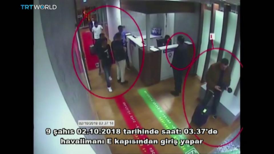 This image taken from surveillance camera shows a still image of people inside Ataturk International Airport, Istanbul, Turkey, on Oct. 2, 2018. The text on the screen from source in Turkish reads: "nine people enter from airport's E Gate on Oct. 2, 2018 around 03:37." A Turkish television station has aired surveillance video of missing writer Jamal Khashoggi walking into the Saudi Consulate in Istanbul and a black van leaving later for the consul's home. The footage aired Wednesday begins by showing the arrival of one of two private jets, then two cars can be seen taking the men to Gate E, where eight of them are seen on camera passing through passport control. (TRT World via AP)