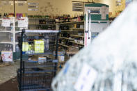Shown is the aftermath of ransacked liquor store in Philadelphia, Wednesday, Sept. 27, 2023. Police say groups of teenagers swarmed into stores across Philadelphia in an apparently coordinated effort, stuffed bags with merchandise and fled. (AP Photo/Matt Rourke)