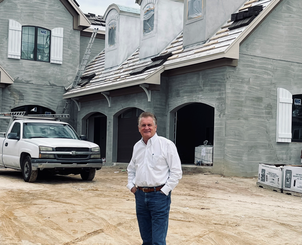 Chuck Fowke outside a home he's building in Florida