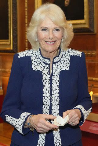 <p>KIRSTY WIGGLESWORTH/POOL/AFP via Getty Images</p> Queen Camilla at Windsor Castle on Jan. 30, 2024