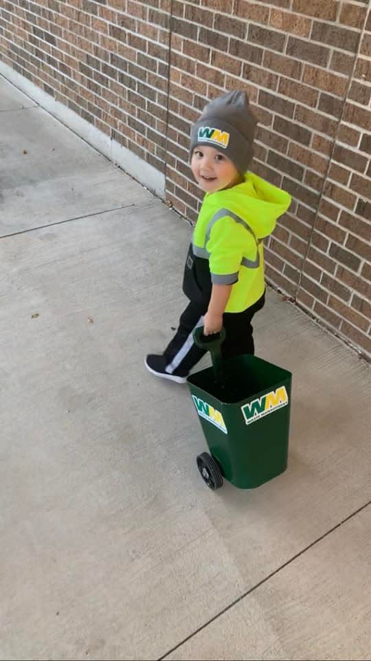 Randi Vanderheide's son Wesson sports a Halloween costume in honor of one of his favorite people: the garbage man. The Kaukauna family modified a small trashcan and purchased a florescent hoodie for the costume.