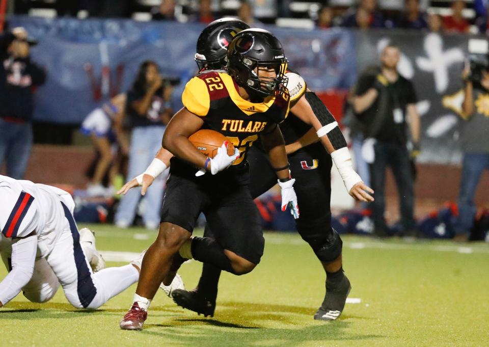 Tulare Union's Tieler Peterson on a long run in the 58th annual Bell rivalry game Friday, October 28, 2022.