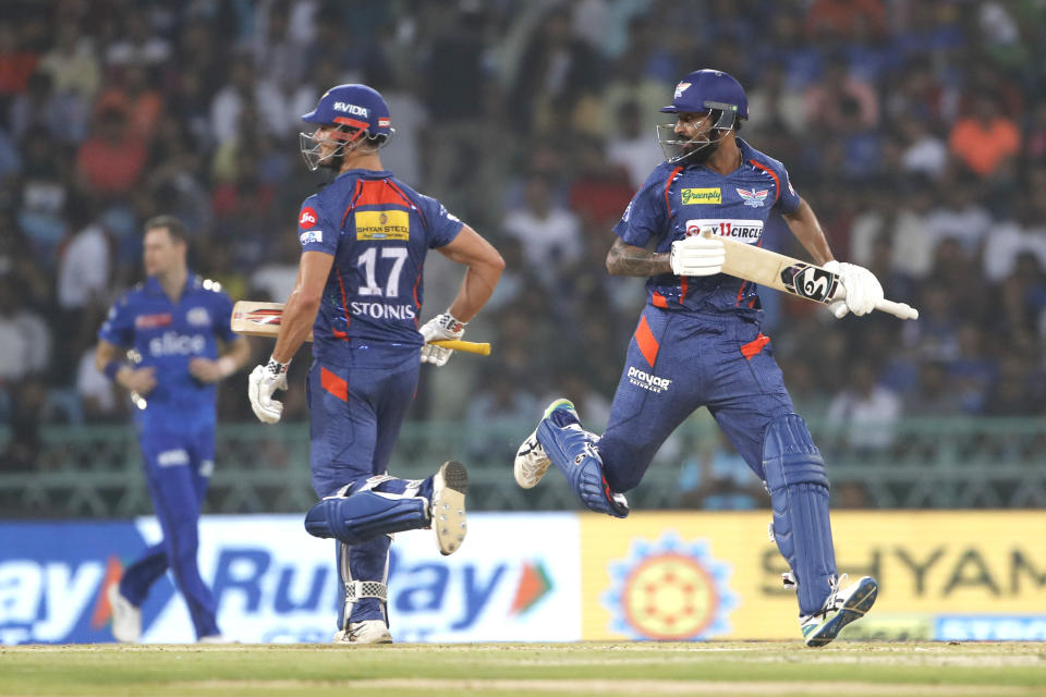 Marcus Stoinis of Lucknow Super Giants, left, and Krunal Pandya take a run during the Indian Premier League cricket match between Lucknow super giants and Mumbai Indians in Lucknow, India, Tuesday, May 16, 2023. (AP Photo/Surjeet Yadav)