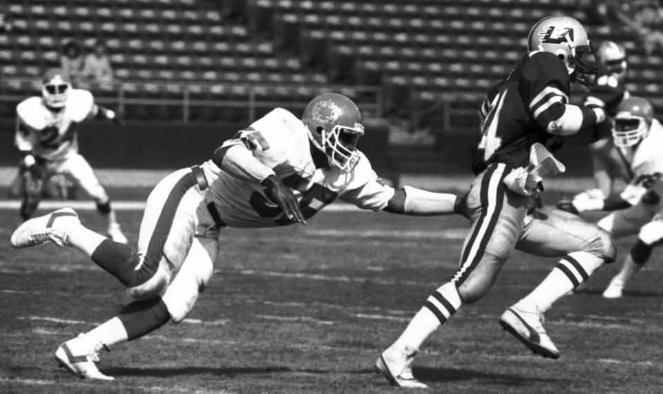 Mandatory Credit: Photo by Doug Pizac/AP/REX/Shutterstock (6025090a) Ray Costict, Tony Boddie New Jersey Generals linebacker Ray Costict (55) attempts a tackle on Los Angeles Express running back Tony Boddie, right, during the second quarter of a USFL football game in Los Angeles. The New England Patriots announced, that former Patriots player Ray Costict died Tuesday, Jan. 3 at the age of 56. Costict spent his entire NFL career with the Patriots from 1977-79, primarily as a special teams player Obit Costict Football, Los Angeles, USA