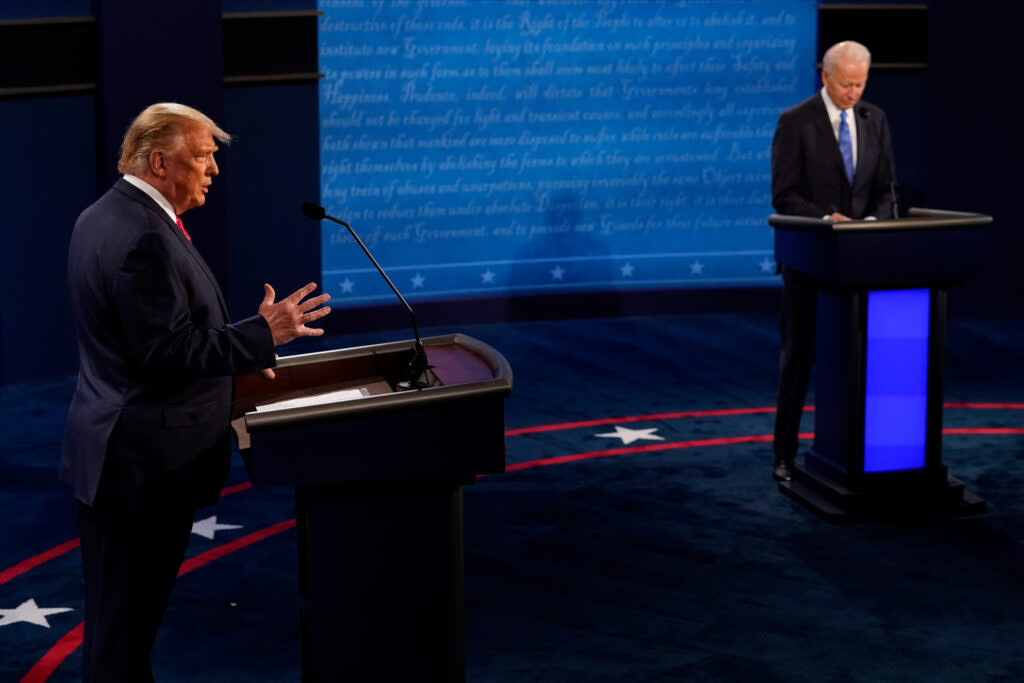 Donald Trump, then president, answers a question as Joe Biden, the Democratic presidential nominee, listens during the second and final presidential debate at Belmont University on Oct. 22, 2020 in Nashville, Tennessee. (Photo by Morry Gash-Pool/Getty Images)