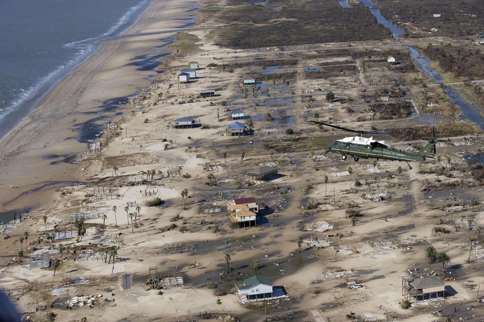 <span class="caption">Then-President George W. Bush inspected a damaged residential area near Galveston, Texas, after Hurricane Ike hit in 2008.</span> <span class="attribution"><span class="source">Jim Watson/AFP via Getty Images)</span></span>