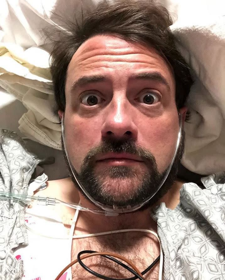 Actor-filmmaker Kevin Smith revealed he had a "massive heart attack" by sharing a selfie from his hospital bed on Feb. 25, 2018. In a lengthy post detailing the events leading up to his hospitalization, the 47-year-old said he was feeling nauseous, sweating profusely and his chest felt heavy. "Turns out I had a massive heart attack. The Doctor who saved my life at the #glendale hospital told me I had 100% blockage of my LAD artery (also known as "the Widow-Maker" because when it goes, you're a goner)," he wrote. "If I hadn't canceled show 2 to go to the hospital, I would've died tonight," he continued.