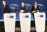 EU chief Brexit negotiator Michel Barnier, left, European Parliament President Antonio Tajani, center and European Parliament Brexit chief Guy Verhofstadt leave after a press conference at the European Parliament in Strasbourg, eastern France, Thursday, Nov.15, 2018. Two British Cabinet ministers, including Brexit Secretary Dominic Raab, resigned Thursday in opposition to the divorce deal struck by Prime Minister Theresa May with the EU — a major blow to her authority and her ability to get the deal through Parliament. (AP Photo/Jean-Francois Badias)