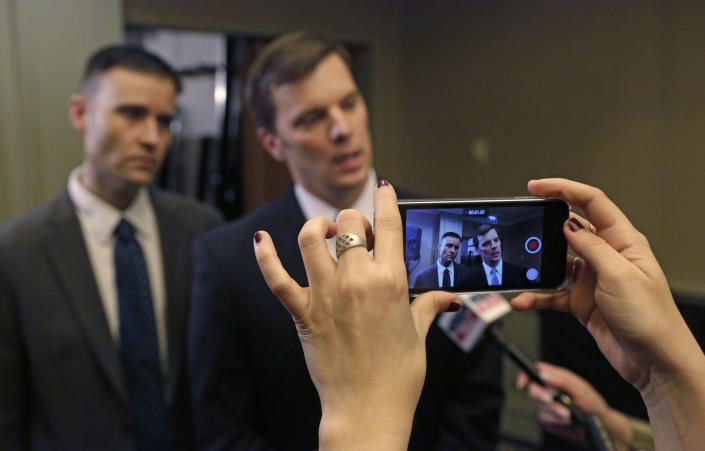 Sigma Alpha Epsilon Fraternity Executive Director Blane Ayers, right, and spokesperson Brandon Weghorst are video recorded as they speak to reporters after a news conference Wednesday, March 18, 2015, in Chicago. The college fraternity that has been under scrutiny since members of its University of Oklahoma chapter were caught on video engaging in a racist chant says it will require all of its members, nationwide, to go through diversity training. Ayers that he was disgusted by the video that surfaced last week. He apologized for the pain it caused and outlined steps meant to ensure it never happens again. (AP Photo/M. Spencer Green)