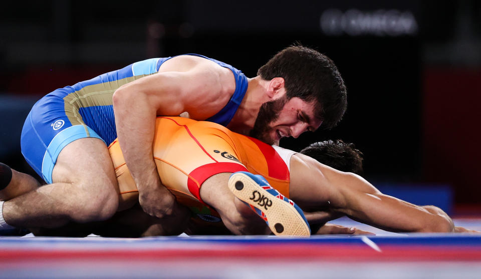 CHIBA, JAPAN - AUGUST 5, 2021: Indias Kumar Ravi (R) and ROC's Zaur Uguev fight in the men's freestyle 57kg final wrestling bout at the 2020 Summer Olympic Games, at the Makuhari Messe convention center. Stanislav Krasilnikov/TASS (Photo by Stanislav Krasilnikov\TASS via Getty Images)