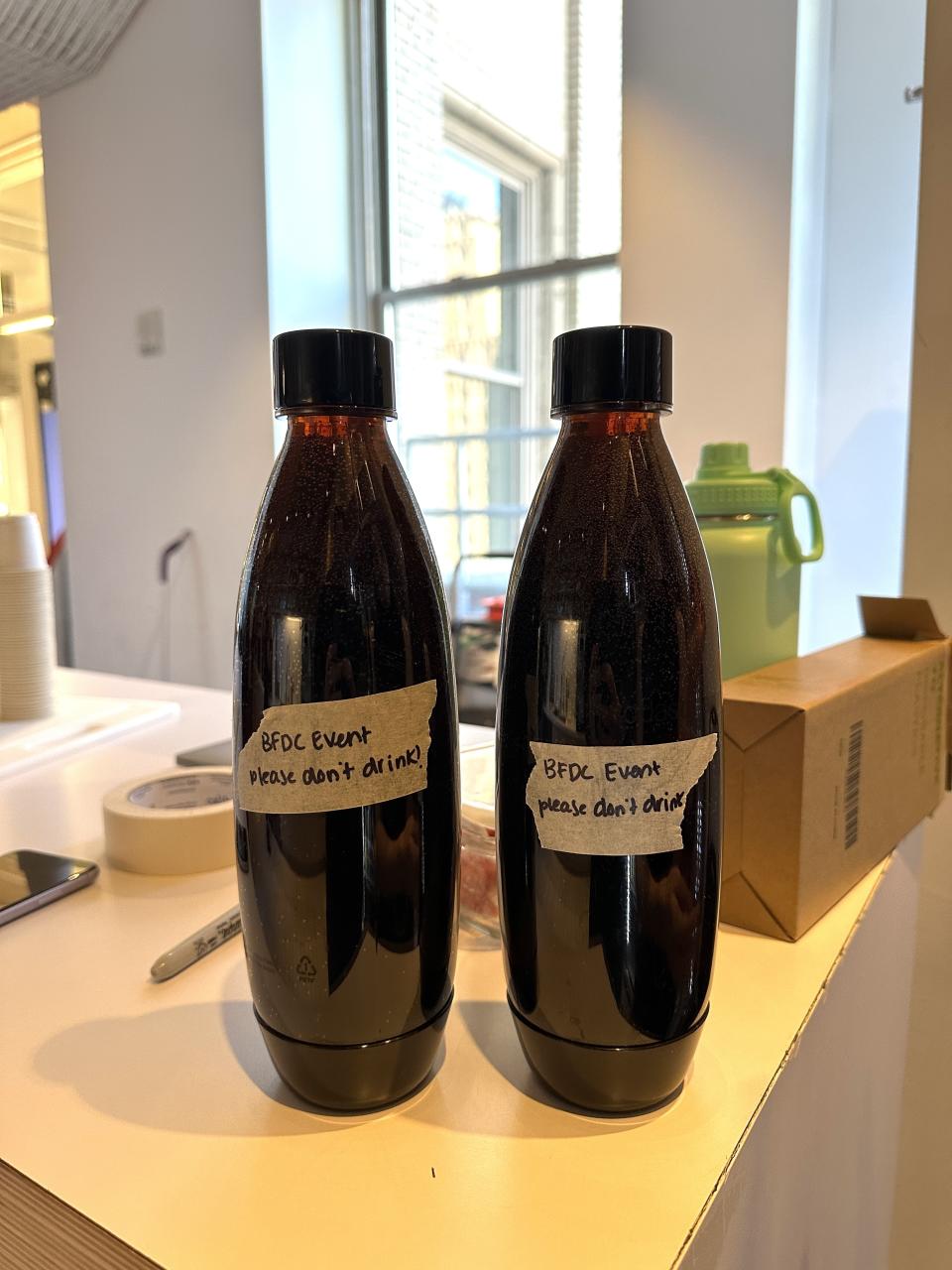 Two SodaStream bottles full of Diet Coke