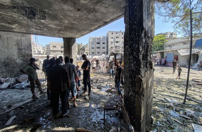 Palestinians inspect the destruction after an Israeli attack on the Al-Zahraa School in the east of Gaza City. Hadi Daoud/APA Images via ZUMA Press Wire/dpa