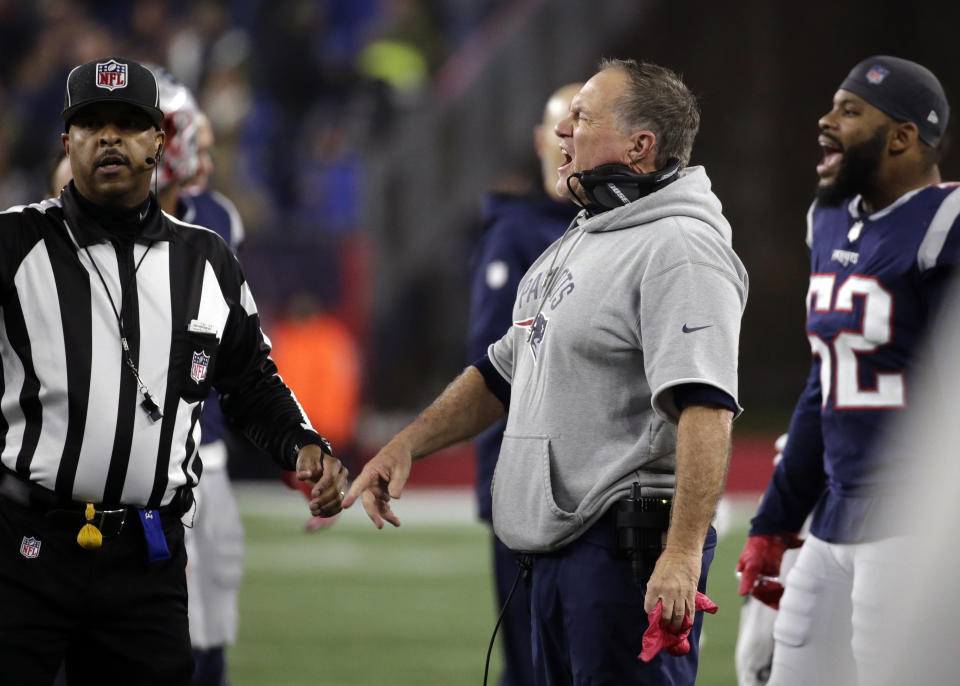 New England Patriots head coach Bill Belichick, center, appeals to side judge Adrian Hill, left, during the second half of an NFL football game against the Minnesota Vikings, Sunday, Dec. 2, 2018, in Foxborough, Mass. (AP Photo/Elise Amendola)