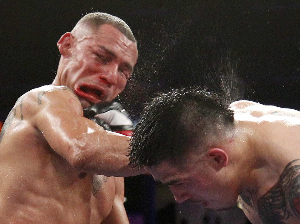 Brandon Rios of the U.S. connects to the face of compatriot Mike Alvarado during the sixth round of their WBO Latino Super Lightweight Title boxing match in Carson, California