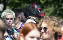 Participants of the Cologne Pride rally meet in Cologne, Germany, Sunday, July 3, 2022. This year's Christopher Street Day (CSD) Gay Parade with thousands of demonstrators for LGBTQ rights is the first after the coronavirus pandemic to be followed by hundreds of thousands of spectators in the streets of Cologne. (AP Photo/Martin Meissner)