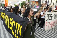 FILE - Activists demonstrate for climate justice and a ceasefire at the COP28 U.N. Climate Summit, Dec. 9, 2023, in Dubai, United Arab Emirates. (AP Photo/Peter Dejong, File)