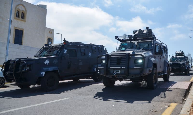 Gendarmerie vehicles deploy outside the new Salt government hospital in the city of Salt