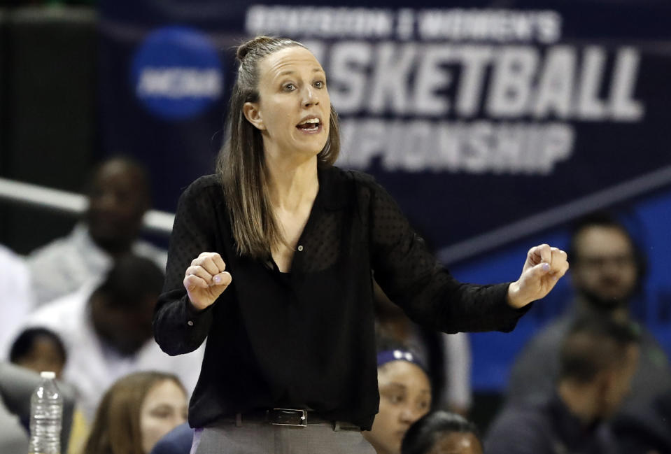 FILE - In this March 23, 2019, file photo, California head coach Lindsay Gottlieb instructs her team in the first half of a first round women's college basketball game in the NCAA Tournament, in Waco, Texas. The Cavaliers have hired former California coach Lindsay Gottlieb as an assistant on John Beilein’s staff. Gottlieb joins Beilein’s staff after serving eight years as the University of California, Berkeley women's basketball head coach, where she led the Golden Bears to a combined 179-89 (.668) record (86-58, .597 in Pac-12) since taking over the helm in 2011-12. (AP Photo/Tony Gutierrez, File)