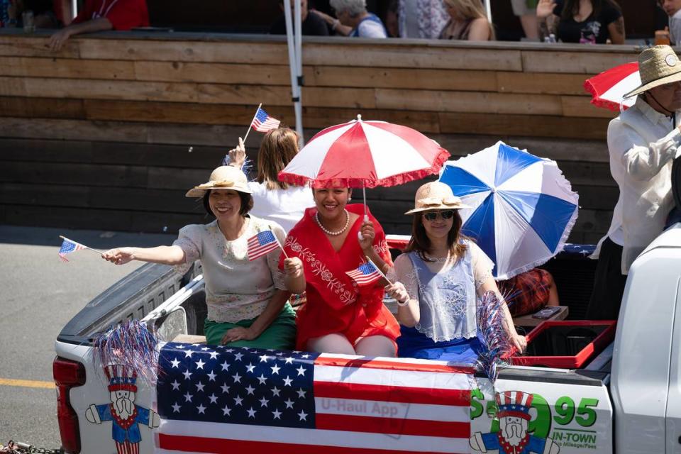 Filipino-American Association members wave to the crowd during the Independence Day Parade in Modesto, Calif., Tuesday, July 4, 2023. Andy Alfaro/aalfaro@modbee.com
