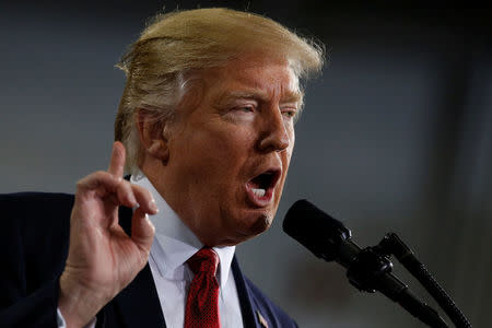 U.S. President Donald Trump delivers remarks U.S. President Donald Trump delivers remarks at the American Center for Mobility, a test facility for driverless car technology for American Manufactured Vehicles in Ypsilanti Township, Michigan, U.S. March 15, 2017. REUTERS/Jonathan Ernst