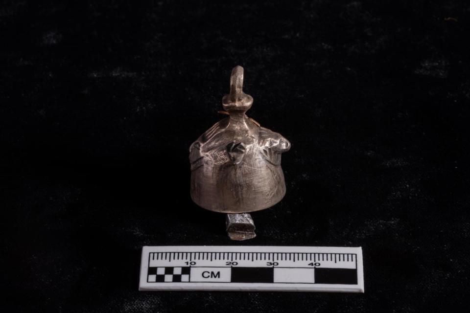 A small bronze bell, discovered in the temple of Ramses II in Abydos, Egypt, is seen in a photo provided by the Egyptian Ministry of Tourism and Antiquities, March 25, 2023. / Credit: Egyptian Ministry of Tourism and Antiquities