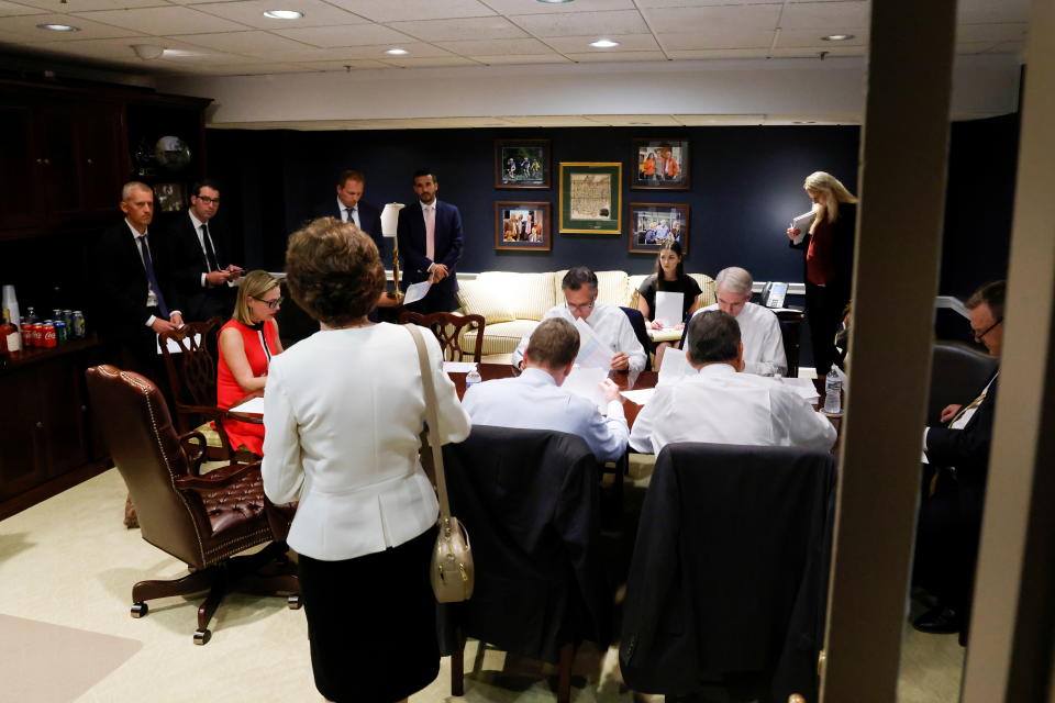 U.S. Senator Susan Collins (R-ME) (back to camera) arrives at a bipartisan meeting on infrastructure with Senator Kyrsten Sinema (D-AZ), Senator Mitt Romney (R-UT), Senator Rob Portman (R-OH), Senator Jon Tester (D-MT) and others in a hideaway office at the U.S. Capitol in Washington, U.S. June 8, 2021.  REUTERS/Jonathan Ernst