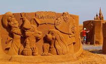 <p>An artist works on a sculpture during the Sand Sculpture Festival “Disney Sand Magic” in Ostend, Belgium June 22, 2017. (Yves Herman/Reuters) </p>