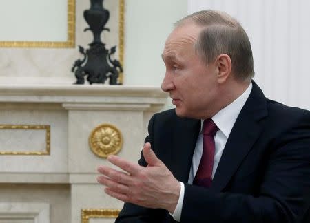Russian President Vladimir Putin talks to Italian President Sergio Mattarella during their meeting at the Kremlin in Moscow, Russia April 11, 2017. REUTERS/Sergei Chirikov/Pool