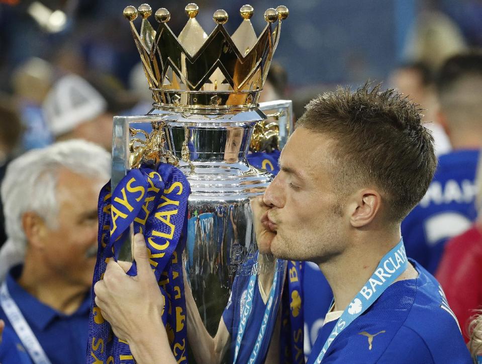 FILE - In this May 7, 2006, file photo, Leicester's Jamie Vardy kisses the trophy as Leicester City celebrates becoming the English Premier League soccer champions at King Power stadium in Leicester, England. From the goat that enjoyed a long, successful run cursing the Cubs to those who bet on Leicester to win the Premier League, it’s been a year to remember. (AP Photo/Matt Dunham, File)