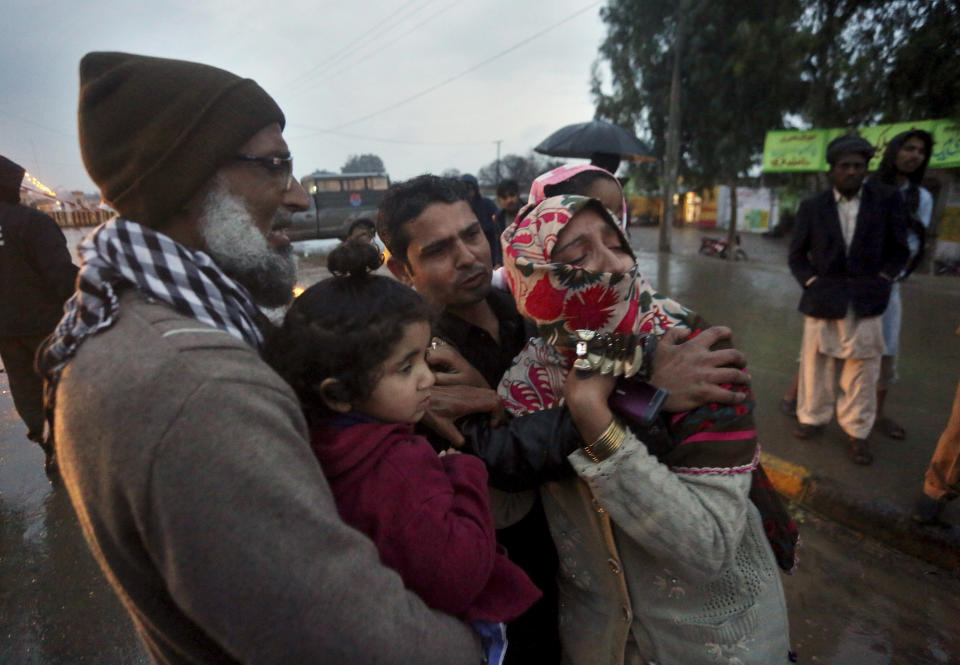 Family members of a Pakistani prisoner Shakir Ullah, who was killed by Indian inmates in an Indian jail, mourn while they wait for his body at Pakistani-India border post Wagah, near Lahore, Pakistan, Saturday, March 2, 2019. Indian authorities have handed over the body of a Pakistani prisoner Ullah who was beaten to death by Indian inmates this month at an Indian jail apparently in retaliation for the Dec. 14 suicide bombing in Indian-controlled Kashmir that killed 40 soldiers. (AP Photo/K.M. Chaudary)