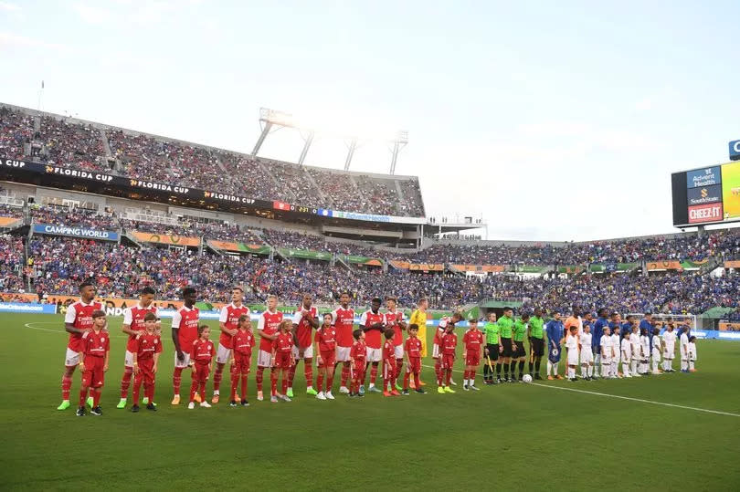 The Arsenal and Chelsea teams line up before a pre season friendly between Chelsea and Arsenal at Camping World Stadium on July 23, 2022 in Orlando, Florida