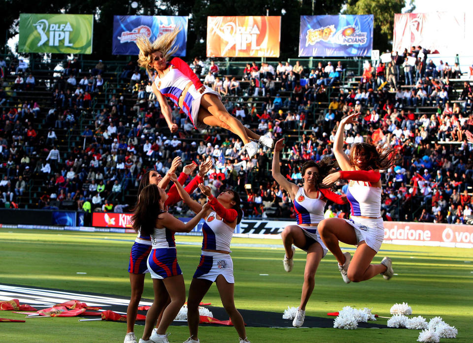 Bangalore Royal Challengers cheerleaders performing in the DLF IPL Twenty20 cricket tournament day/night Match between the
