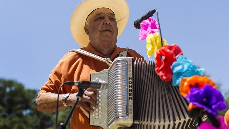 Conjunto Johnny Degollado y Su Conjunto band performs during the Cinco de Mayo celebration hosted by City Council Member Mike Martinez at City Hall Plaza in Austin, Texas, on Monday, May 5, 2014.