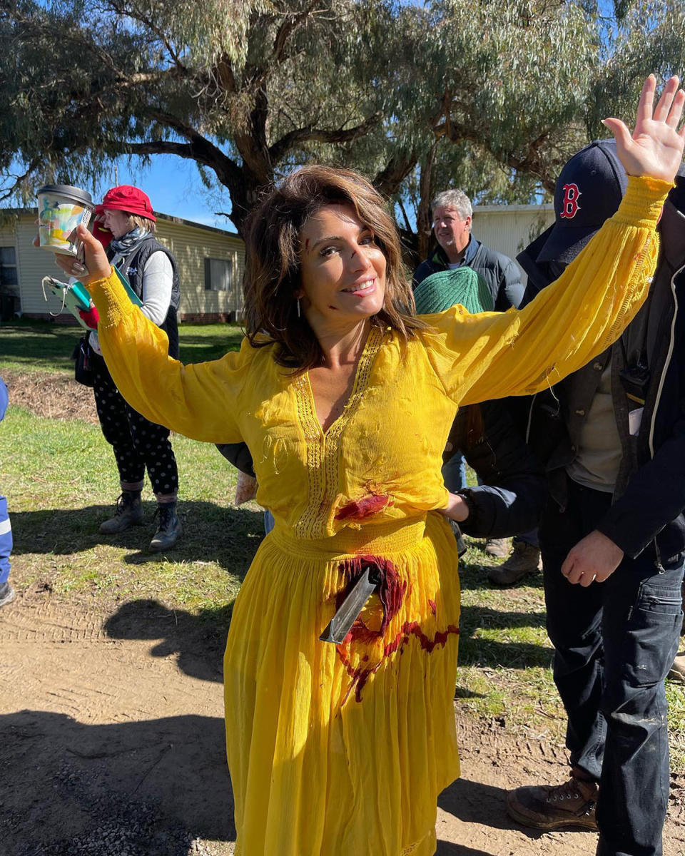 Ada Nicodemou as Leah Patterson with a pole sticking out of her abdomen