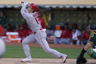 Los Angeles Angels designated hitter Shohei Ohtani (17) flies out against the Oakland Athletics during the first inning of a baseball game in Oakland, Calif., Monday, July 19, 2021. (AP Photo/Jeff Chiu)