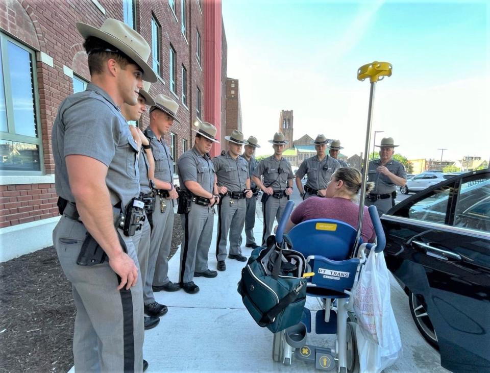 New York State Trooper Becky Seager, who was injured in a shootout Wednesday, June 9, 2021 in Broome County, is greeted by a line of troopers Thursday afternoon after her release from Wilson Memorial Hospital.
