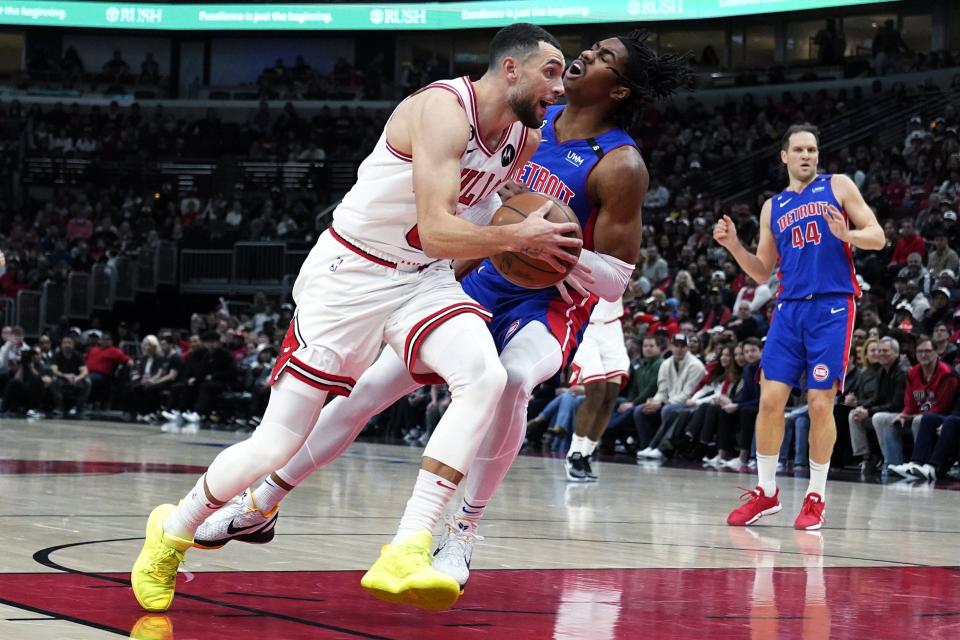 Bulls guard Zach LaVine, left, drives to the basket against Pistons guard Jaden Ivey during the first half in Chicago on Friday, Dec. 30, 2022.