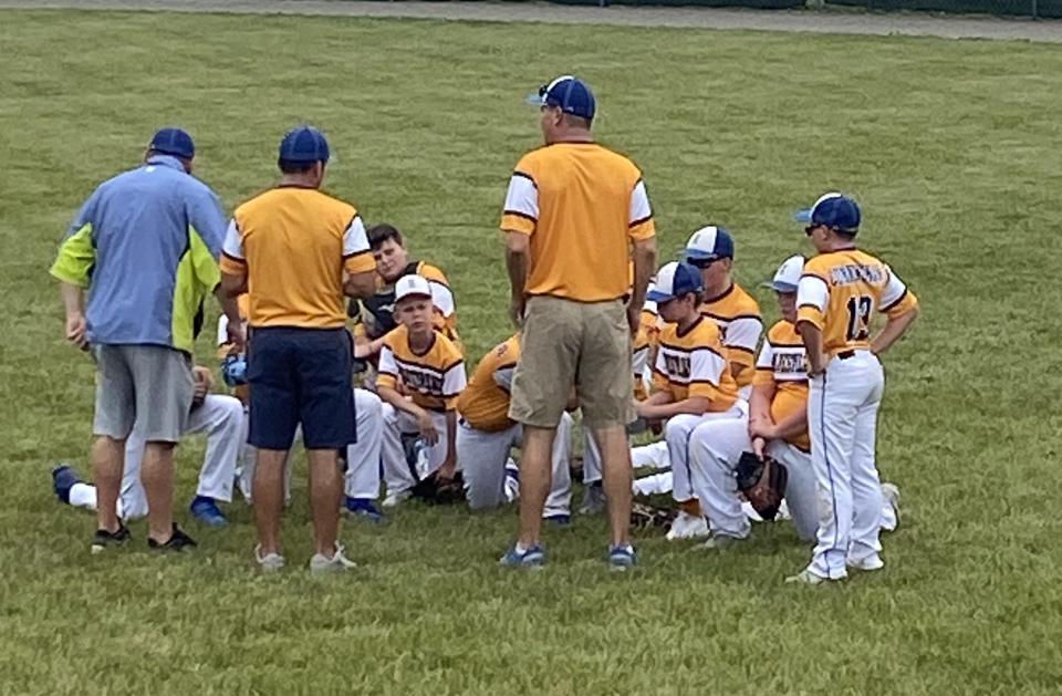 Ida coach Eric Mason talks to his team after a 21-0 win over Frenchtown Saturday in the 63rd annual Monroe County Fair Baseball Tournament.