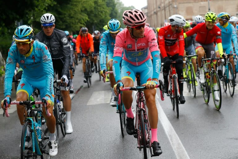 Vincenzo Nibali (C), Michele Scarponi (L) and Bob Jungels (2nd L) take the start of the 21th and last stage of the Giro d'Italia