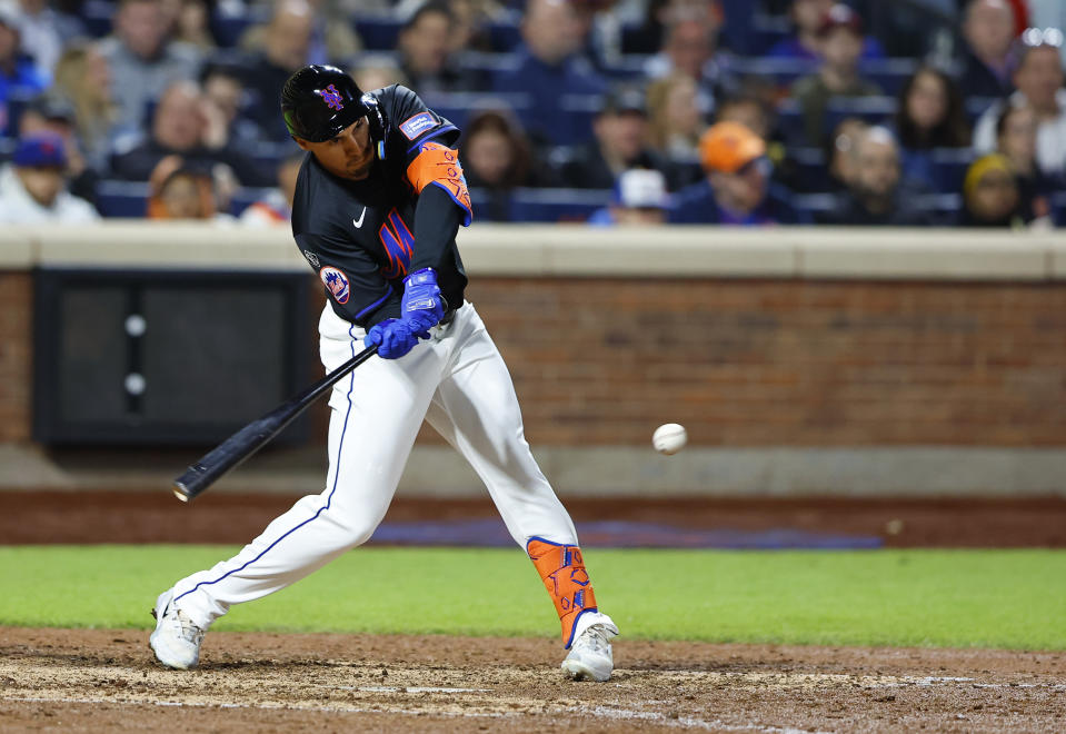New York Mets' Tyrone Taylor hits a single against the Philadelphia Phillies during the seventh inning of a baseball game, Monday, May 13, 2024, in New York. (AP Photo/Noah K. Murray)