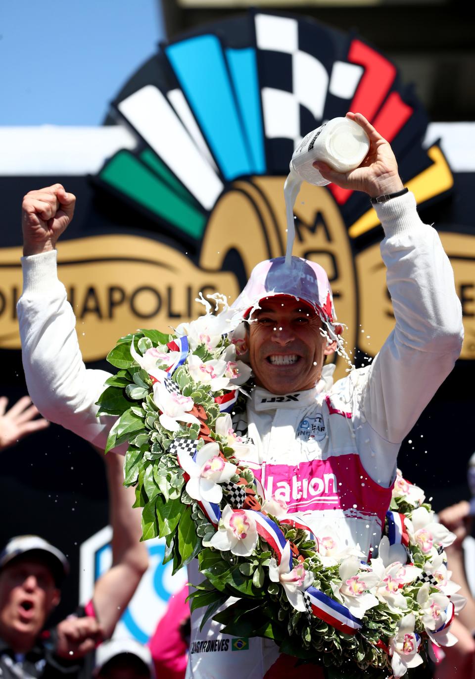 Meyer Shank Racing driver Helio Castroneves (6) pours milk over his head Sunday, May 30, 2021, after winning the 105th running of the Indianapolis 500 at Indianapolis Motor Speedway.